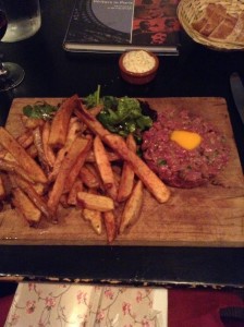 Beef tartare--yep, that's raw, chopped beef mixed with things like capers and other tasty ingredients, served with a raw egg in the center and fries at La Balancoire in Montmartre. I devoured every morsel.